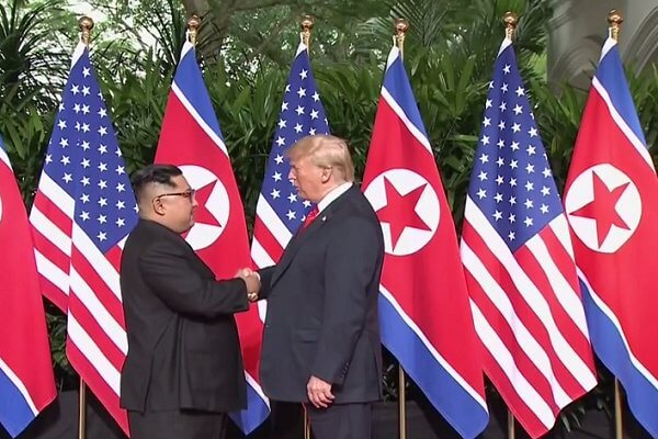 Photo of Trump, Kim sign joint document at historic summit