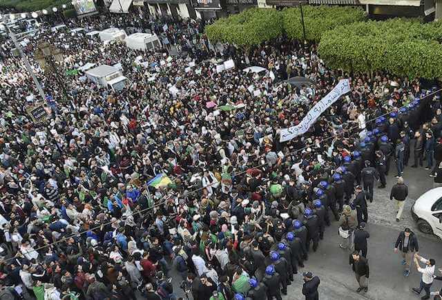 Photo of Algerians Take to Streets in Largest Anti-Government Protest in Decades